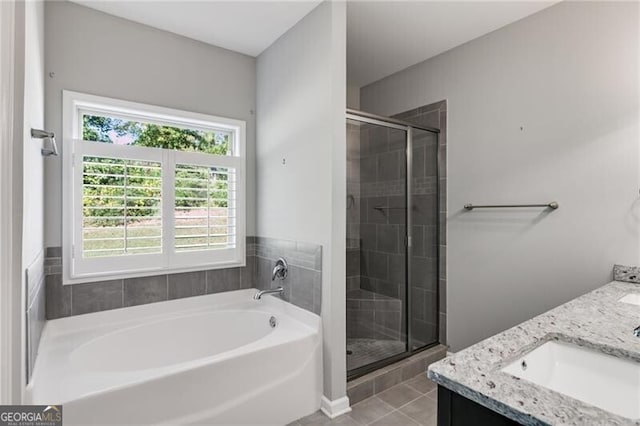 bathroom with vanity, shower with separate bathtub, and tile patterned floors