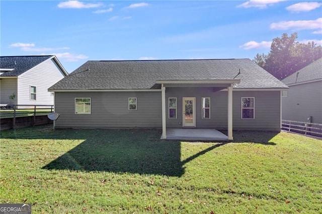 back of house featuring a yard and a patio