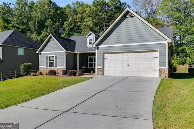 view of front facade featuring a front yard and a garage