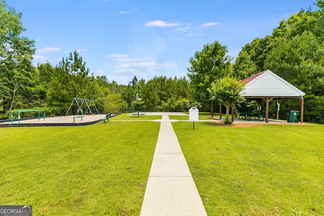 view of community with a gazebo, a lawn, and a playground