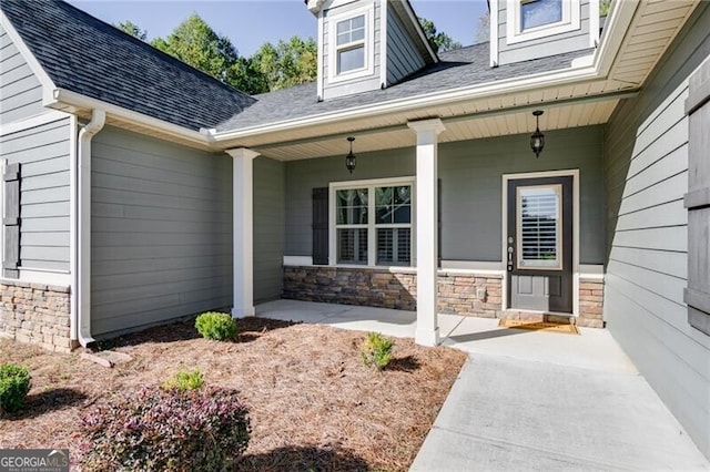 doorway to property featuring covered porch