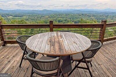 wooden deck featuring a mountain view