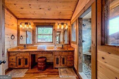 bathroom with vanity, hardwood / wood-style floors, and wooden ceiling