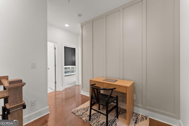 office space with wood-type flooring