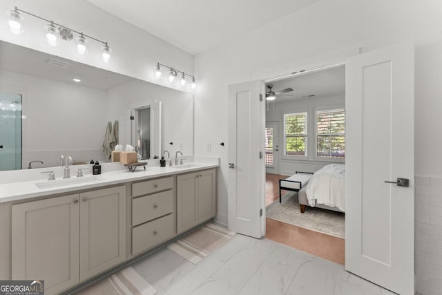 bathroom with an enclosed shower, wood-type flooring, vanity, and ceiling fan