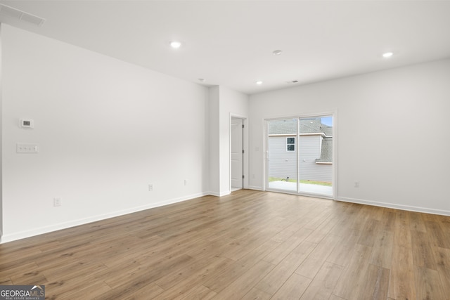 unfurnished room featuring light hardwood / wood-style flooring