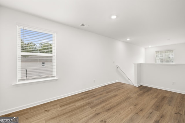 spare room with hardwood / wood-style flooring