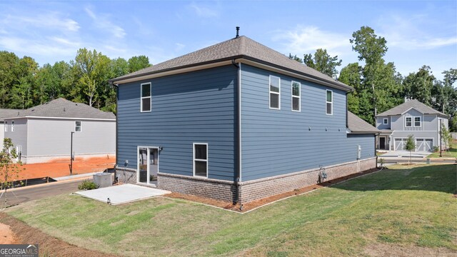 view of home's exterior featuring a patio and a yard