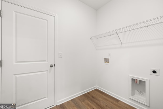 laundry area featuring hookup for a washing machine, dark hardwood / wood-style flooring, and electric dryer hookup