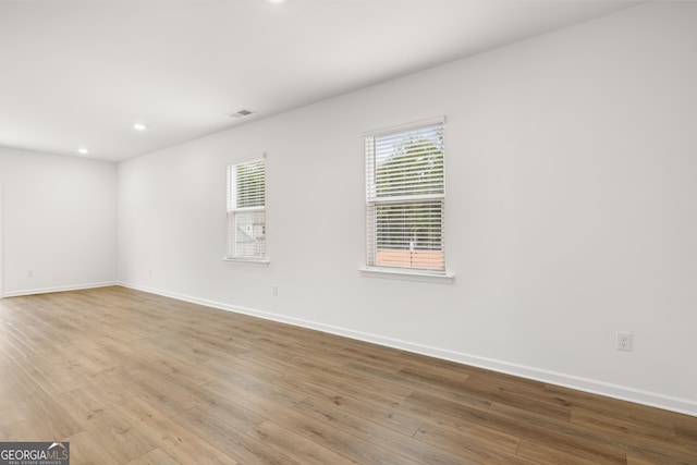 unfurnished room with light hardwood / wood-style flooring