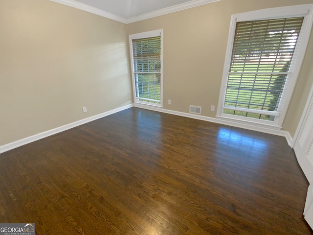 unfurnished room with dark hardwood / wood-style flooring and a healthy amount of sunlight