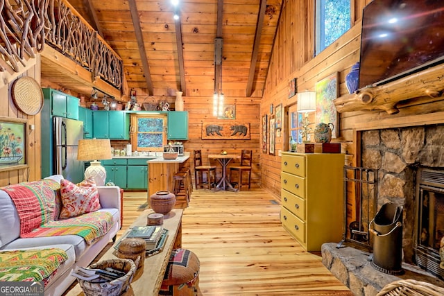 living room with wooden ceiling, wooden walls, lofted ceiling with beams, and light wood-type flooring