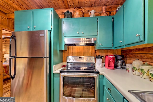 kitchen featuring appliances with stainless steel finishes, hardwood / wood-style flooring, and wooden ceiling