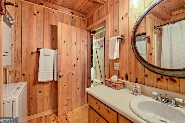 bathroom featuring wood ceiling, vanity, wooden walls, and hardwood / wood-style flooring