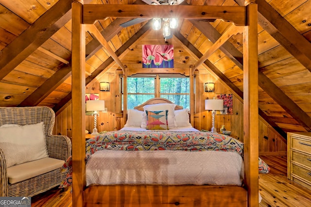 bedroom featuring lofted ceiling with beams, wooden walls, ceiling fan, hardwood / wood-style floors, and wooden ceiling