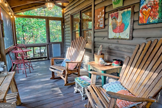 sunroom / solarium with vaulted ceiling and ceiling fan