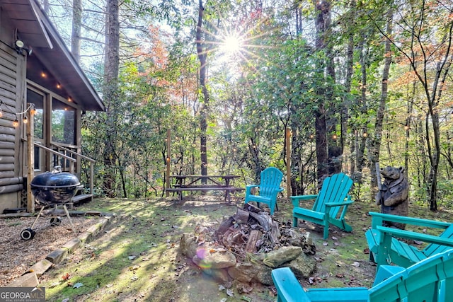 view of yard featuring a fire pit