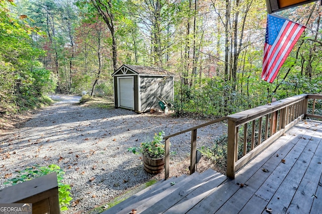 wooden deck featuring a storage unit