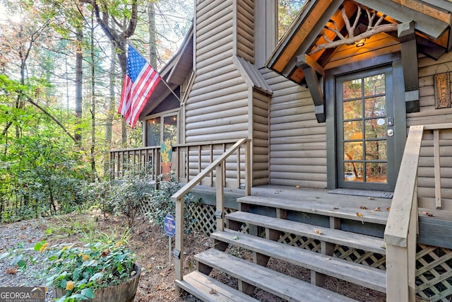 doorway to property featuring a deck