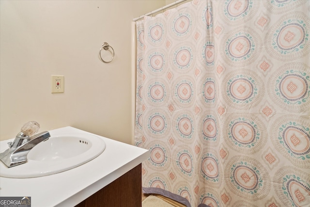 bathroom with vanity and a shower with shower curtain