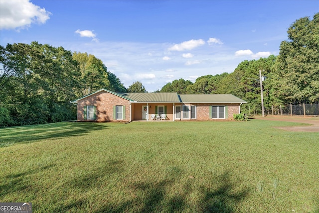 ranch-style house with a front lawn