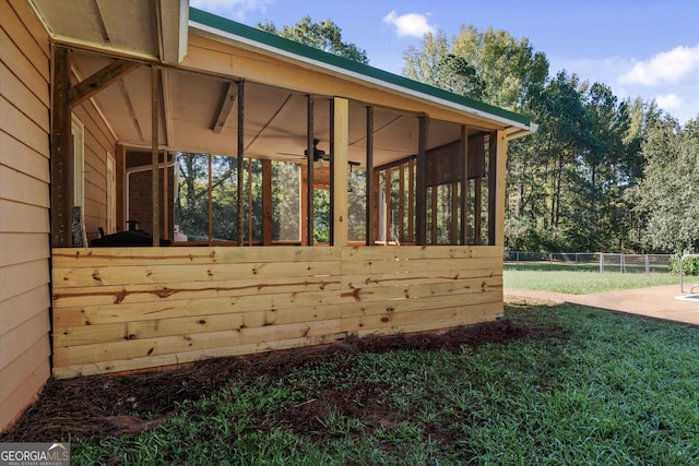 view of side of property with a sunroom