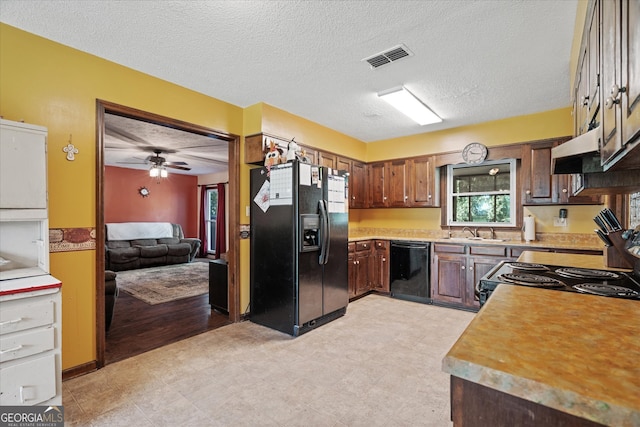 kitchen featuring ceiling fan, a textured ceiling, sink, and black appliances