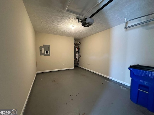 garage featuring gas water heater, electric panel, and a garage door opener