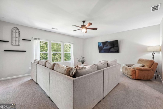 living room featuring ceiling fan and light carpet