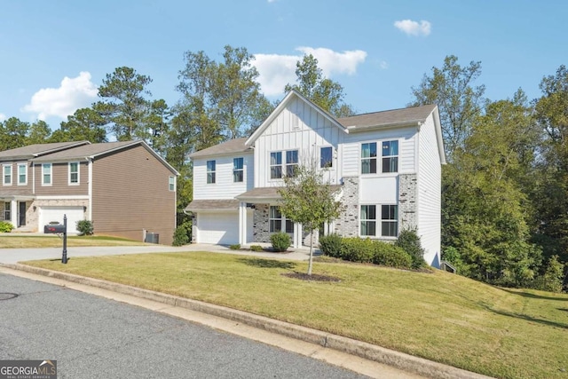 view of front of house with a front lawn and a garage