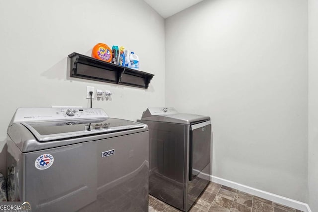 laundry room with independent washer and dryer