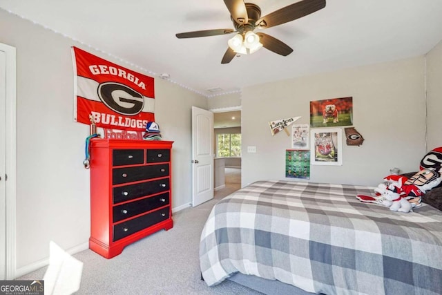 bedroom with ceiling fan and carpet flooring