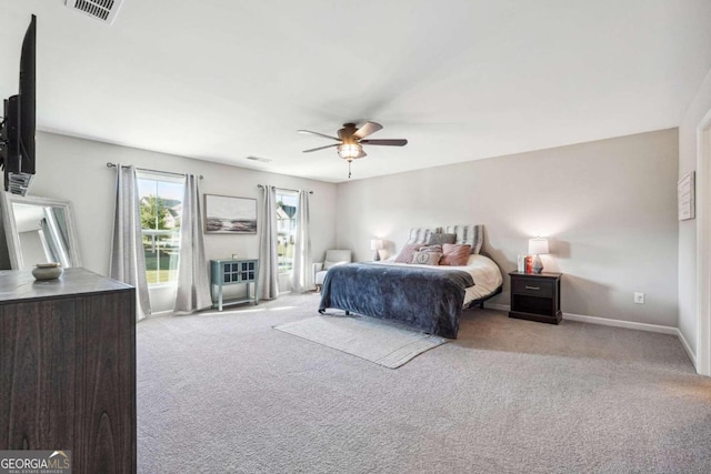 bedroom featuring ceiling fan and light colored carpet