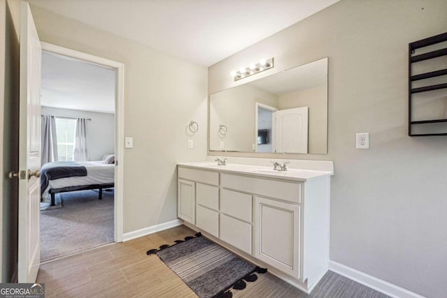 bathroom with hardwood / wood-style floors and vanity