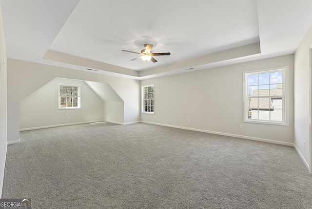 additional living space with ceiling fan and carpet floors