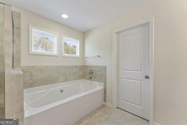 bathroom with a bathing tub