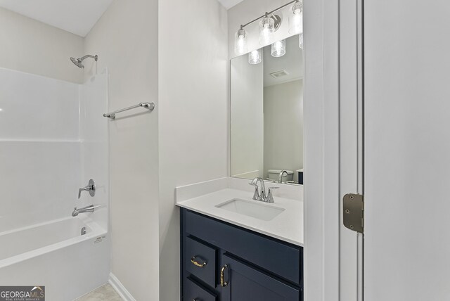 bathroom with shower / bathtub combination and vanity