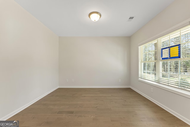 empty room featuring hardwood / wood-style floors