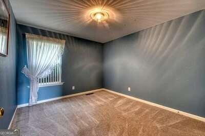 unfurnished room featuring carpet flooring