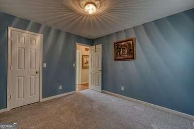 unfurnished bedroom with carpet floors