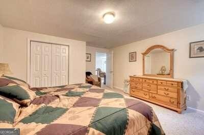 bedroom with a closet and carpet flooring