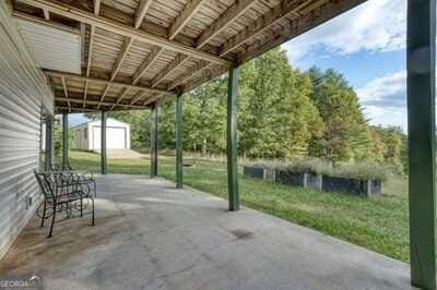 view of patio / terrace with a storage shed