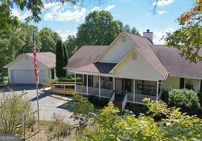 view of front of property featuring a garage and a porch