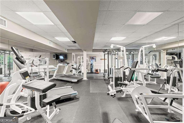 gym featuring a drop ceiling