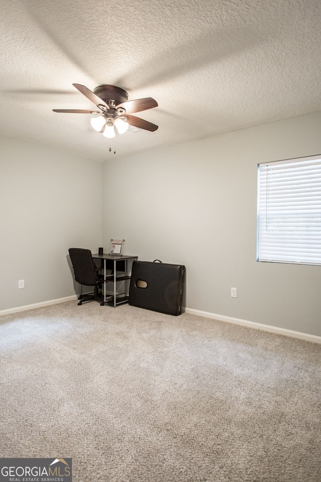 living area with carpet floors, a textured ceiling, and ceiling fan