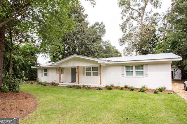 ranch-style home featuring a front yard