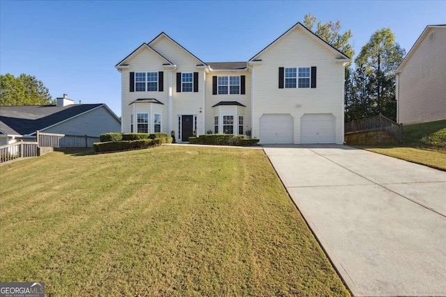 view of front of home with a garage and a front yard