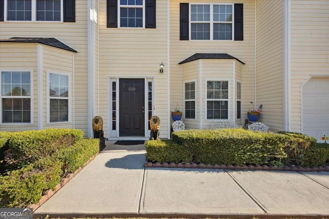 entrance to property featuring a garage