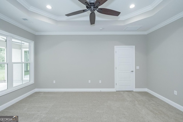 245 Ryan Nicholas Dr, Kingsland, GA 31548 - carpeted spare room with ornamental molding, a ceiling fan, a tray ceiling, and visible vents