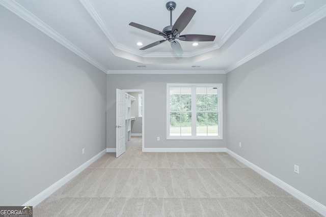 245 Ryan Nicholas Dr, Kingsland, GA 31548 - interior space with light colored carpet, crown molding, a tray ceiling, and a walk in closet